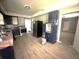 Kitchen featuring wood look flooring, stainless steel appliances, and dark blue cabinets at 763 N Hairston Rd, Stone Mountain, GA 30083