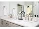 Bright bathroom featuring double sinks, white countertops, and modern fixtures at 1762 Beckham Ne Pl, Atlanta, GA 30324
