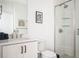 Modern bathroom showcasing a glass-enclosed shower and a sleek vanity with a quartz countertop at 1762 Beckham Ne Pl, Atlanta, GA 30324