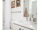 Modern bathroom with white vanity, chrome fixtures, and shower with glass door at 1762 Beckham Ne Pl, Atlanta, GA 30324