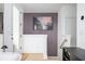 Welcoming entryway with hardwood floors, white wainscoting, and a modern art piece at 1762 Beckham Ne Pl, Atlanta, GA 30324