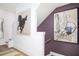 Entryway with decorative art and white and plum color palette at 1762 Beckham Ne Pl, Atlanta, GA 30324