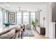 Open-concept living room flowing from the kitchen, featuring modern decor and ample natural light at 1762 Beckham Ne Pl, Atlanta, GA 30324