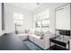 Bright living room with an L-shaped sofa, natural light, and modern accents at 1762 Beckham Ne Pl, Atlanta, GA 30324