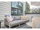 Comfortable outdoor patio featuring a modern sofa, stylish pillows, and a cozy seating arrangement at 1762 Beckham Ne Pl, Atlanta, GA 30324