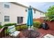 Backyard featuring a wooden deck, with outdoor seating and grill, perfect for relaxation and entertaining at 1926 Cheatham Woods Sw Dr, Marietta, GA 30008