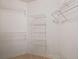 Walk-in closet featuring white wire shelving providing ample storage space at 1926 Cheatham Woods Sw Dr, Marietta, GA 30008