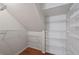 Walk-in closet with custom shelving offering plenty of storage space at 1926 Cheatham Woods Sw Dr, Marietta, GA 30008