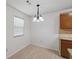 Dining area is bright with a chandelier and view from the window at 1926 Cheatham Woods Sw Dr, Marietta, GA 30008