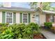 Inviting one-story home with green shutters, a manicured yard, and brick accents for added character at 1926 Cheatham Woods Sw Dr, Marietta, GA 30008