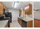 Charming kitchen with wood cabinets, granite counters, and stainless appliances at 1926 Cheatham Woods Sw Dr, Marietta, GA 30008