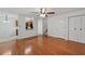 Open-concept living room featuring hardwood floors, a pass-through to the kitchen, and natural light at 1926 Cheatham Woods Sw Dr, Marietta, GA 30008