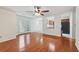 Bright living room features hardwood floors, ceiling fan, and access to the back yard at 1926 Cheatham Woods Sw Dr, Marietta, GA 30008