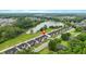 Stunning aerial view of townhomes near a serene lake and lush greenery, highlighting the community's beauty at 2326 Britt St, Grayson, GA 30017