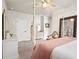 Bright bedroom featuring a four-poster bed, and a view to a door at 2326 Britt St, Grayson, GA 30017