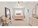 Charming bedroom featuring a four-poster bed, neutral walls, and a ceiling fan at 2326 Britt St, Grayson, GA 30017