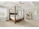 Spacious bedroom features a four-poster bed, neutral walls, and vaulted ceilings at 2326 Britt St, Grayson, GA 30017