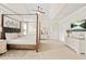Spacious bedroom features a four-poster bed, neutral walls, and vaulted ceilings at 2326 Britt St, Grayson, GA 30017