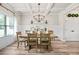 Bright dining room with coffered ceilings, farmhouse-style table, and wainscoting at 2326 Britt St, Grayson, GA 30017