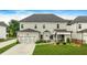 Charming two-story home boasts a manicured lawn, attached garage, and inviting curb appeal at 2326 Britt St, Grayson, GA 30017