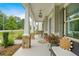 Inviting front porch with stone columns, comfortable seating, and decorative accents at 2326 Britt St, Grayson, GA 30017