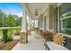 Inviting front porch with stone columns, comfortable seating, and decorative accents at 2326 Britt St, Grayson, GA 30017