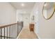 Second floor hallway with natural light and neutral walls and carpet at 2326 Britt St, Grayson, GA 30017