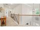 Second floor hallway with a staircase and neutral walls and carpet at 2326 Britt St, Grayson, GA 30017