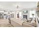 Open-concept living room with fireplace, hardwood floors, and seamless flow into the modern kitchen at 2326 Britt St, Grayson, GA 30017
