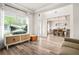 Bright living room with a view into the dining room featuring coffered ceilings at 2326 Britt St, Grayson, GA 30017