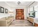 Comfortable living room with wood floors, a hutch, and abundant natural light at 2326 Britt St, Grayson, GA 30017