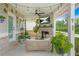 Relaxing outdoor porch with comfortable seating, a fireplace, and stylish decor, perfect for entertaining at 2326 Britt St, Grayson, GA 30017