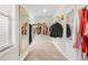 Bright walk-in closet featuring plenty of hanging storage and carpet at 2326 Britt St, Grayson, GA 30017