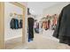 Spacious walk-in closet with ample storage and carpet flooring at 2326 Britt St, Grayson, GA 30017