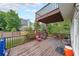 Wooden deck with a view of green backyard and fence, offering space for outdoor entertaining at 2684 Mountain Oaks Ct, Powder Springs, GA 30127