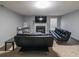 Finished basement area featuring a fireplace and comfortable seating, perfect for relaxation at 2684 Mountain Oaks Ct, Powder Springs, GA 30127