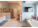 A bathroom featuring double sinks, a walk-in shower, a bathtub, and bright natural light at 2684 Mountain Oaks Ct, Powder Springs, GA 30127
