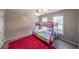 Cozy bedroom featuring a bunk bed, a ceiling fan and large windows at 2684 Mountain Oaks Ct, Powder Springs, GA 30127