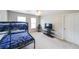 Neutral bedroom featuring a bunk bed and a large TV at 2684 Mountain Oaks Ct, Powder Springs, GA 30127