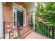 Charming front porch with brick accents and decorative touches, creating a welcoming entryway at 2684 Mountain Oaks Ct, Powder Springs, GA 30127