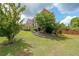 Well-maintained lawn and landscaping around a brick home, providing an inviting and picturesque setting at 2684 Mountain Oaks Ct, Powder Springs, GA 30127
