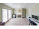 Well-lit home office with a fireplace and access to the backyard at 2684 Mountain Oaks Ct, Powder Springs, GA 30127