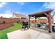 A serene backyard featuring a patio with grill, a covered gazebo with sitting and dining, and wooden fencing at 3735 Westhaven Dr, Cumming, GA 30040