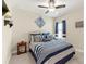 A bedroom featuring a bed, matching furniture, natural light, and pleasing decorative touches at 3735 Westhaven Dr, Cumming, GA 30040