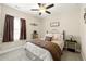 Cozy bedroom with neutral colors, comfortable bedding, decorative pillows, and a window with natural light at 3735 Westhaven Dr, Cumming, GA 30040