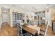 An open dining area has a wooden table and chairs, as well as a china cabinet and access to the kitchen at 3735 Westhaven Dr, Cumming, GA 30040