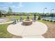 Community fire pit with Adirondack chairs overlooking tennis courts and neighborhood at 3735 Westhaven Dr, Cumming, GA 30040