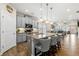 Spacious eat-in kitchen with gray cabinets, granite countertops, an island with bar seating and stainless appliances at 3735 Westhaven Dr, Cumming, GA 30040