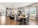 Open concept kitchen with stainless appliances, gray cabinets, and island with bar seating and eat-in kitchen at 3735 Westhaven Dr, Cumming, GA 30040