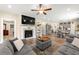 A view of the living room showcases the fireplace, a comfortable sitting arrangement, and dining area at 3735 Westhaven Dr, Cumming, GA 30040